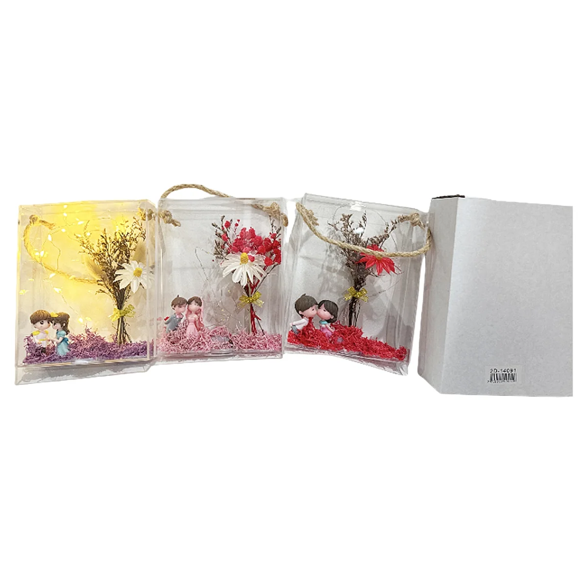FLORES ARTIFICIALES CON NOVIOS Y LUZ EN CAJA CRISTAL